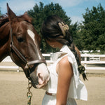 Big Effing Clip in Brownstone model standing next a horse with Big Effing Clip in Brownstone in hair