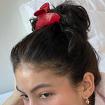 Big Effing Clip in Cherry Kiss closeup of model showing how to wear Big Effing Clip in Cherry Kiss in hair