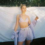 Big Effing Clip in Fairy Wings model standing with Big Effing Clip in Fairy Wings clipped to shoulder strap