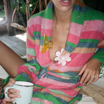 Big Effing Clip in Honeycomb Big Effing Clip in Honeycomb + Big Daisy Clip in Marshmallow clipped to robe