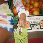 Cotton Scrunchie in Gardenia model wearing Cotton Scrunchie in Gardenia on wrist