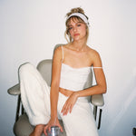 Pointelle Headband in Frosted Lilac model sitting with Pointelle Headband in Frosted Lilac in hair