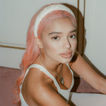 Halo Headband in White Embroidery closeup of Halo Headband in White Embroidery in hair