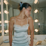 Mariposa Clip in Sweet Cloud model standing in front of mirror with Mariposa Clip in Sweet Cloud in hair