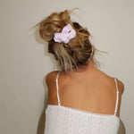 Pointelle Scrunchie in Frosted Lilac model wearing pointelle scrunchie in frosted lilac in hair