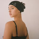 Star Headband in Noir closeup of model wearing Star Headband in Noir