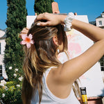 Super Bloom Clip in Guava model wearing Super Bloom Clip in Guava in hair