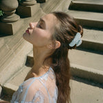 Sweetheart Clip in Something Blue model standing with Sweetheart Clip in Something Blue in hair