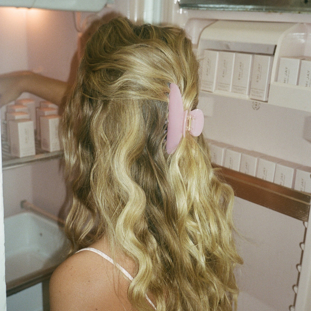 close up of Big Effing Clip in Cherub Pink in hair