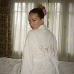 model wearing emi jay robe in white with Big Effing Clip in Cherub Pink in hair