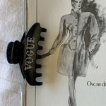 Big Effing Clip in Vogue attached to magazine
