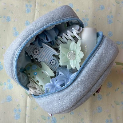 Sweet Like Honey Pouch in Airy Blue filled with hair accessories