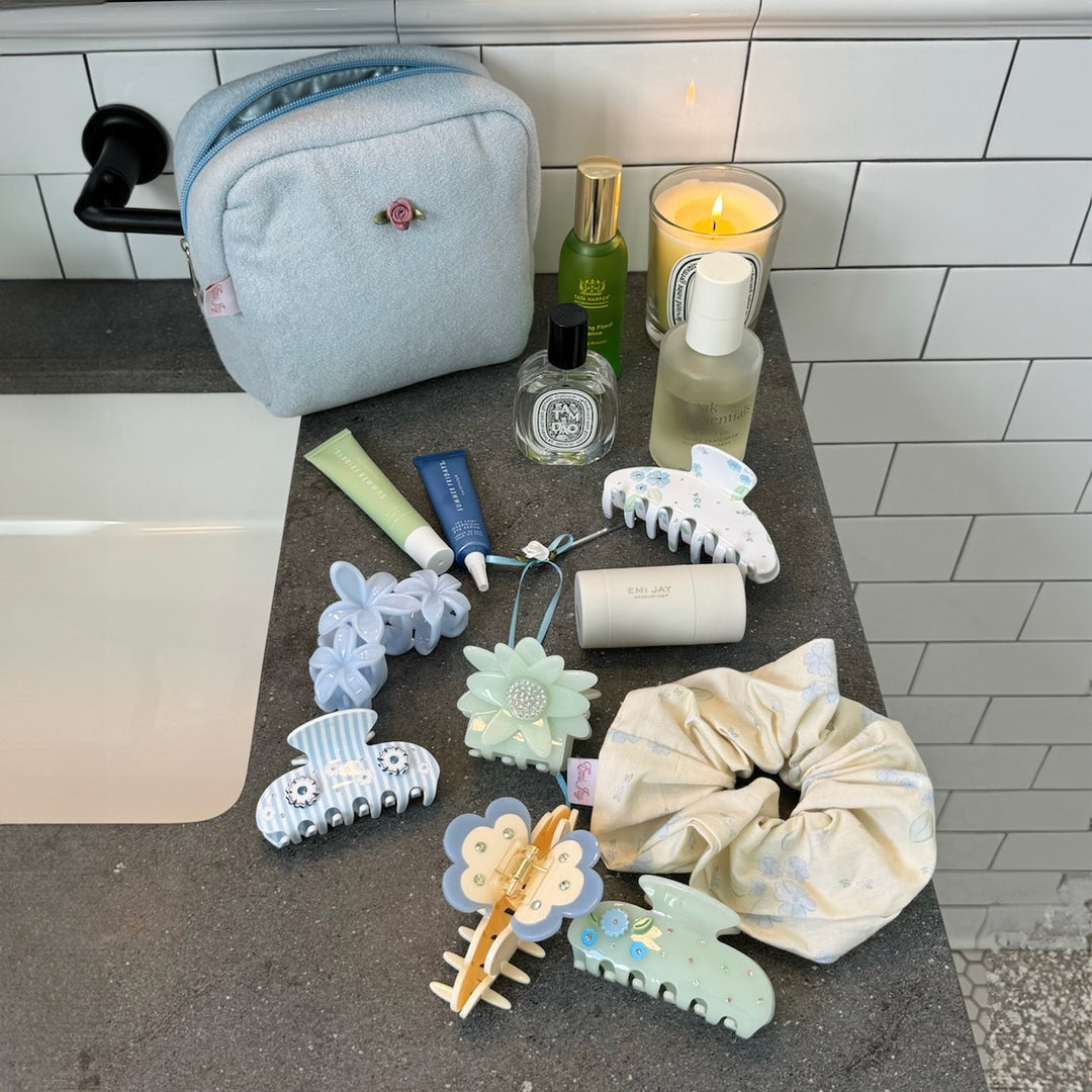 Sweet Like Honey Pouch in Airy Blue on counter with hair accessories