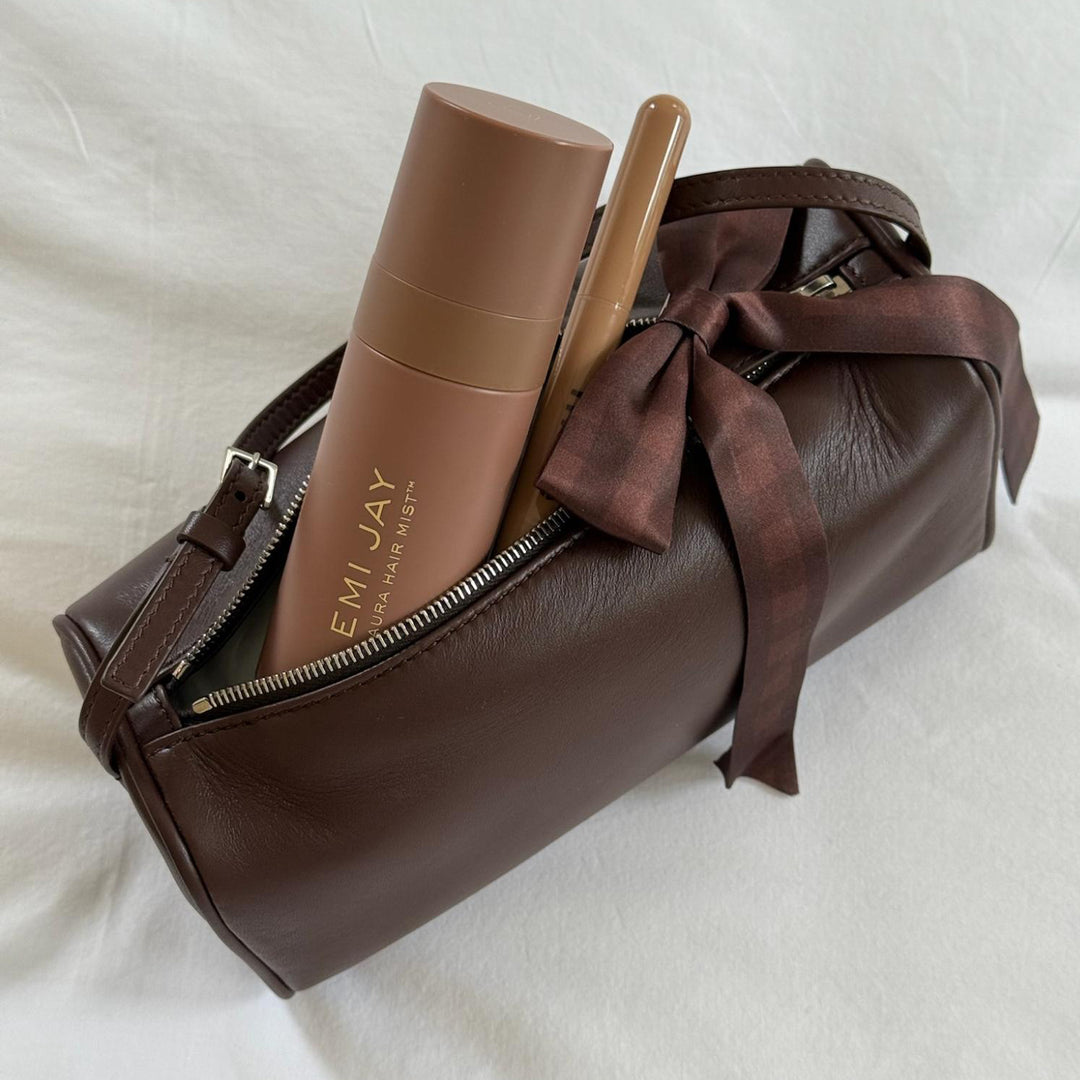 Aura Hair + Body Mist in Toasted Sugar with Bow Barrette in Fireside on purse.