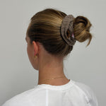 model wearing Cozy Scrunchie in Cookie Crumbs Knit in hair