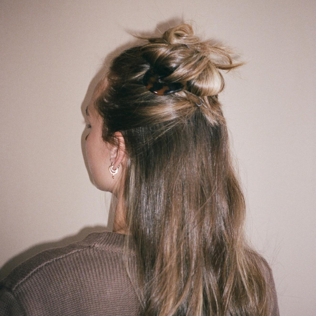 Close-up of model wearing Hair Pin in Tortoise in hair.