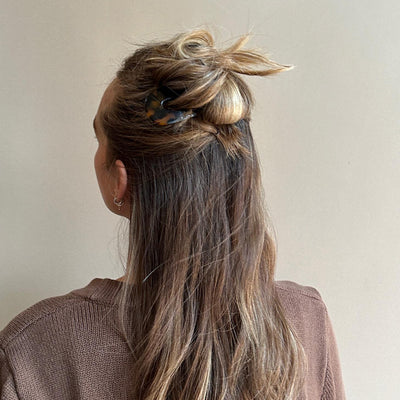 Model wearing Hair Pin in Tortoise in hair.