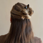 Model wearing Hair Pin in Tortoise Bow in hair.