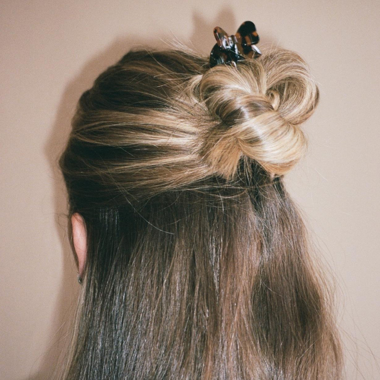 Close-up of model wearing Hair Pin in Tortoise Bow.