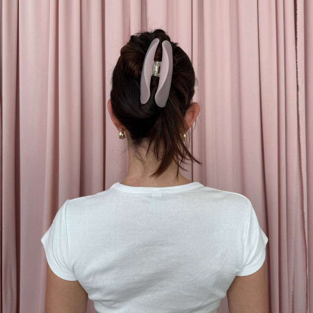 model wearing Half Moon Clip in Pink Smoke in hair