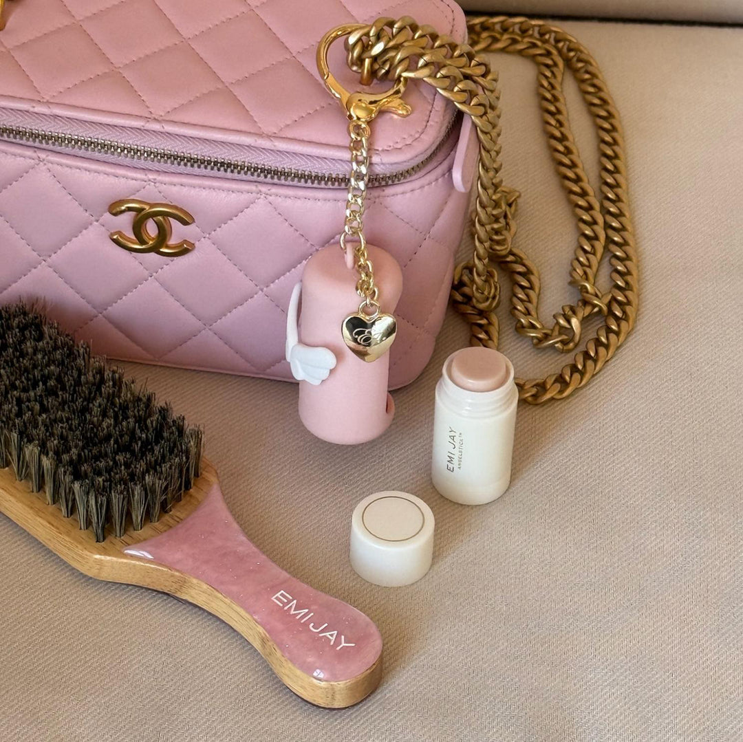 Mini Angelstick + Keychain attached to bag next to open Mini Angelstick and Mini Boar Brush in Pink Sugar