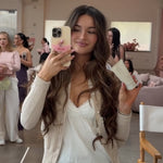 model holding angel hold and phone with Limited Edition Angel Phone Grip attached