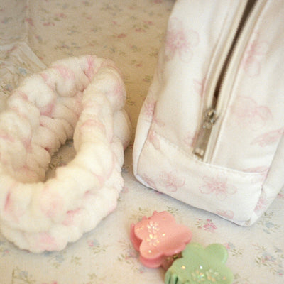 Sugar Blossom Pouch in Milk next to other Sugar Blossom products