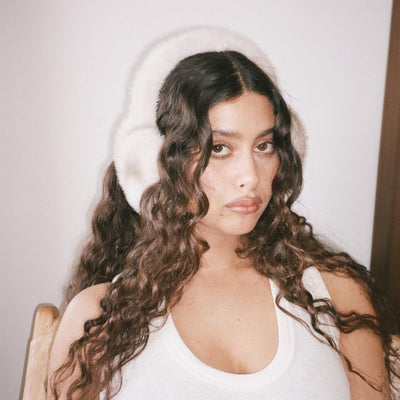 Model wearing Sugar Muffs in Après Ski.