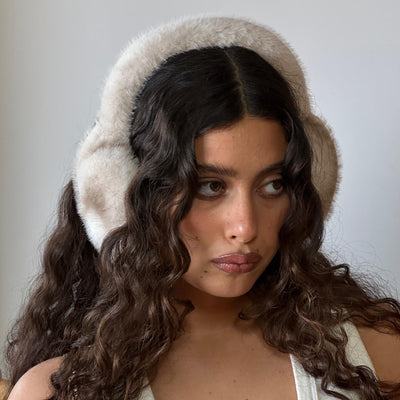 Closeup of model wearing Sugar Muffs in Après Ski.