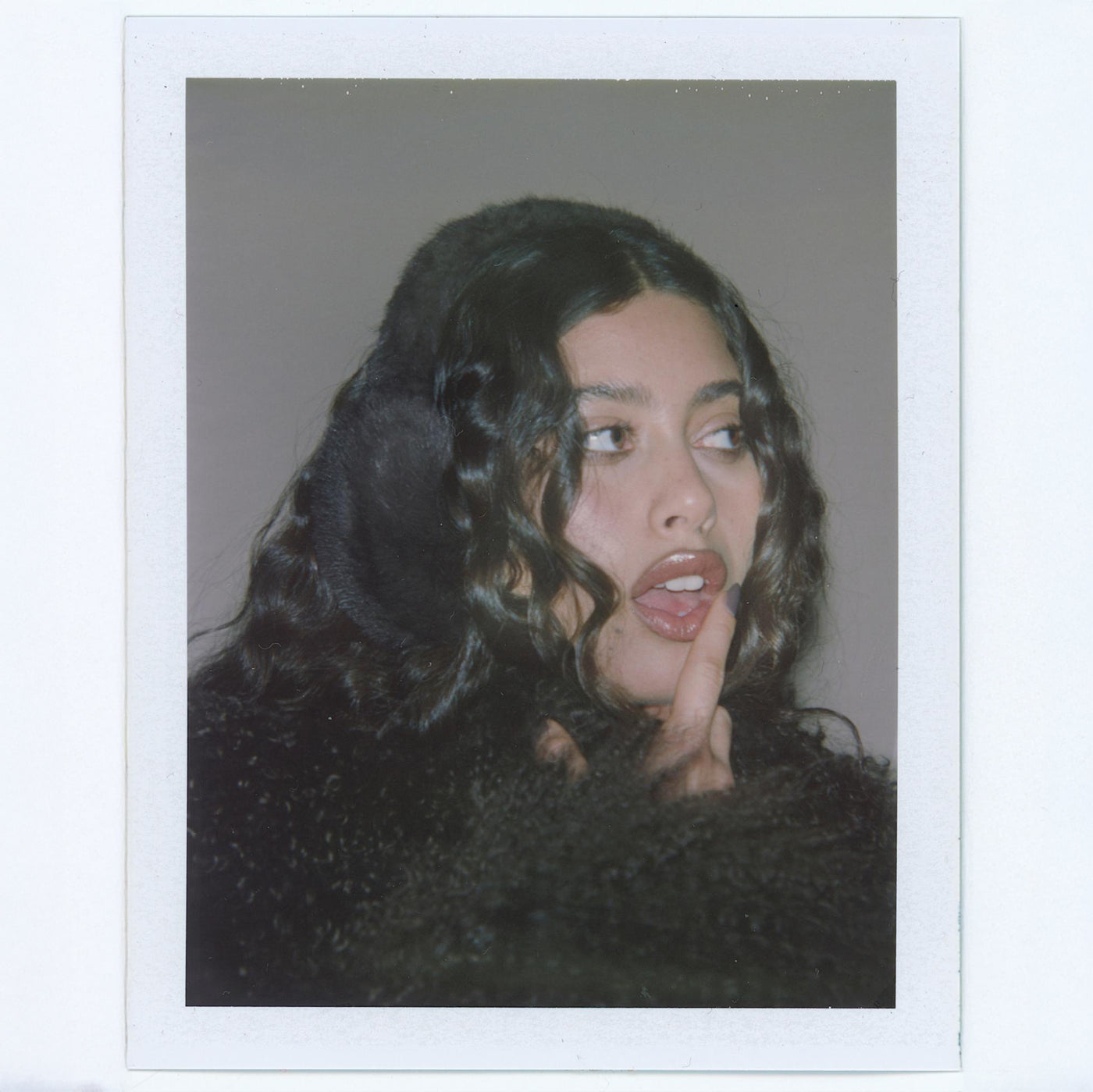 Polaroid of model wearing Sugar Muffs in Espresso Martini.