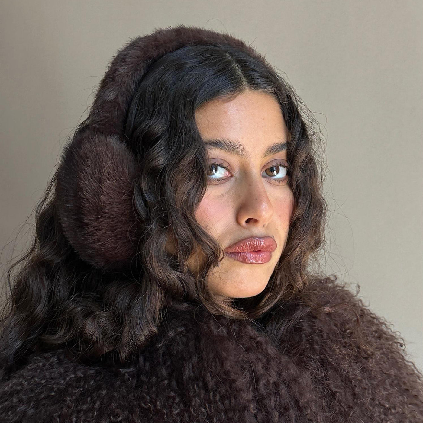 Model wearing Sugar Muffs in Espresso Martini.