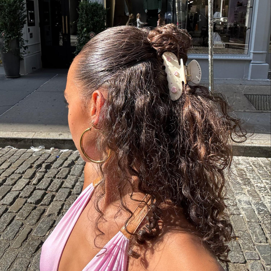closeup of model wearing sweetheart clip in angel aura in hair
