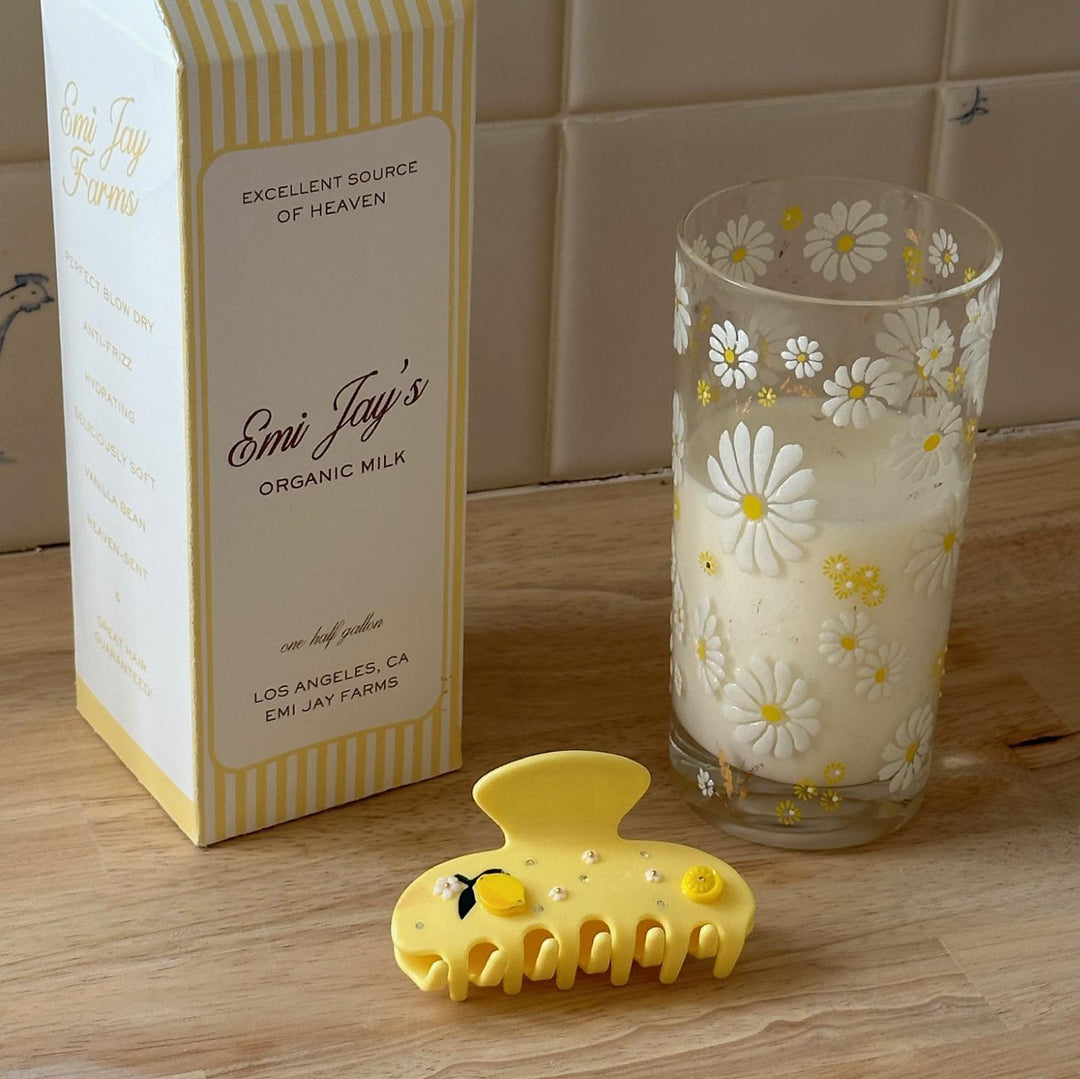 Sweetheart Clip in Hugo Spritz next to a cup of milk and milk carton