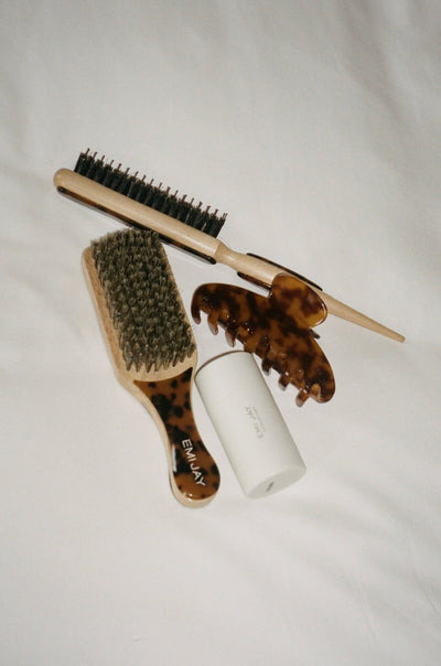 angelstick next to tortoise hair brushes and big effing clip