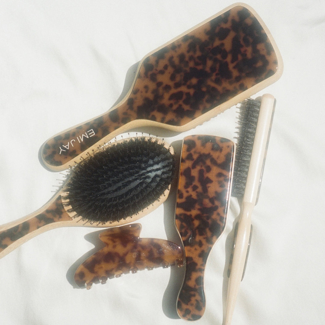 Styling Brush in Tortoise with assorted tortoise brushes and big effing clip