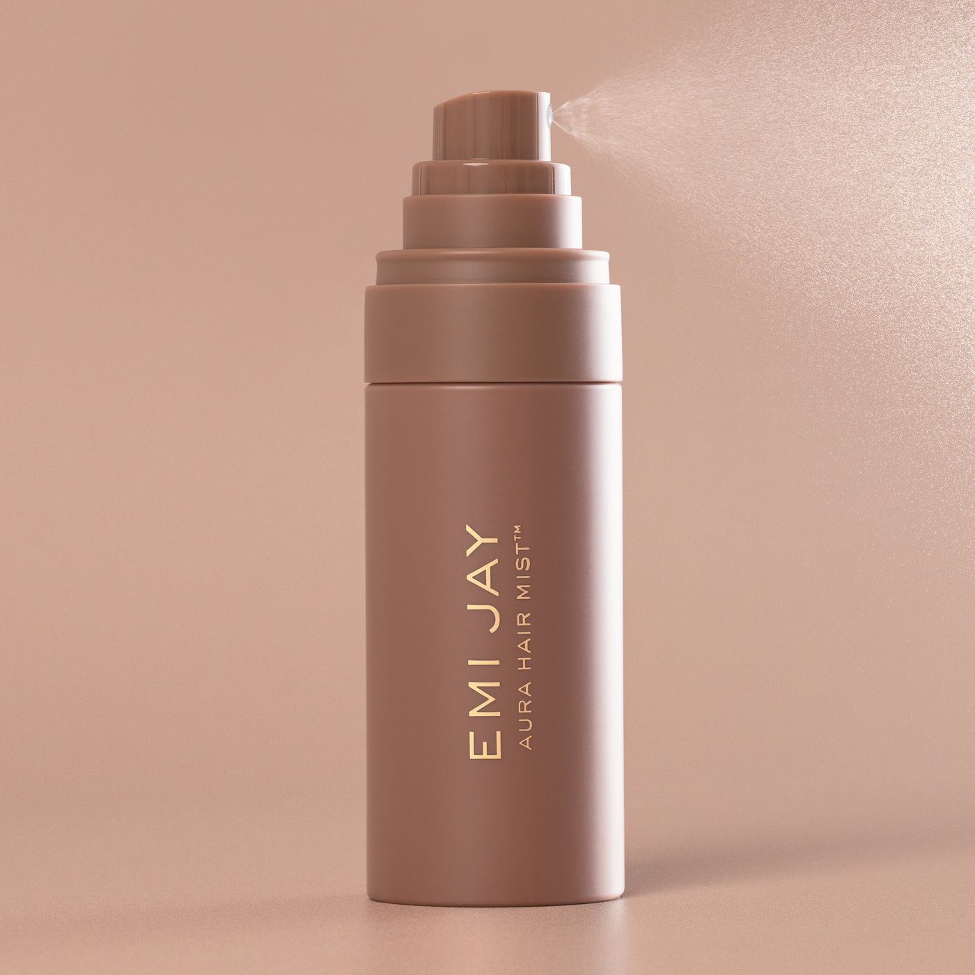 Aura Hair + Body Mist™ in Toasted Sugar spraying mist