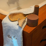 counter with emi jay towel and assorted hair care and accessories