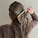 Model using Bamboo Paddle Brush in Toasted Sugar in hair.