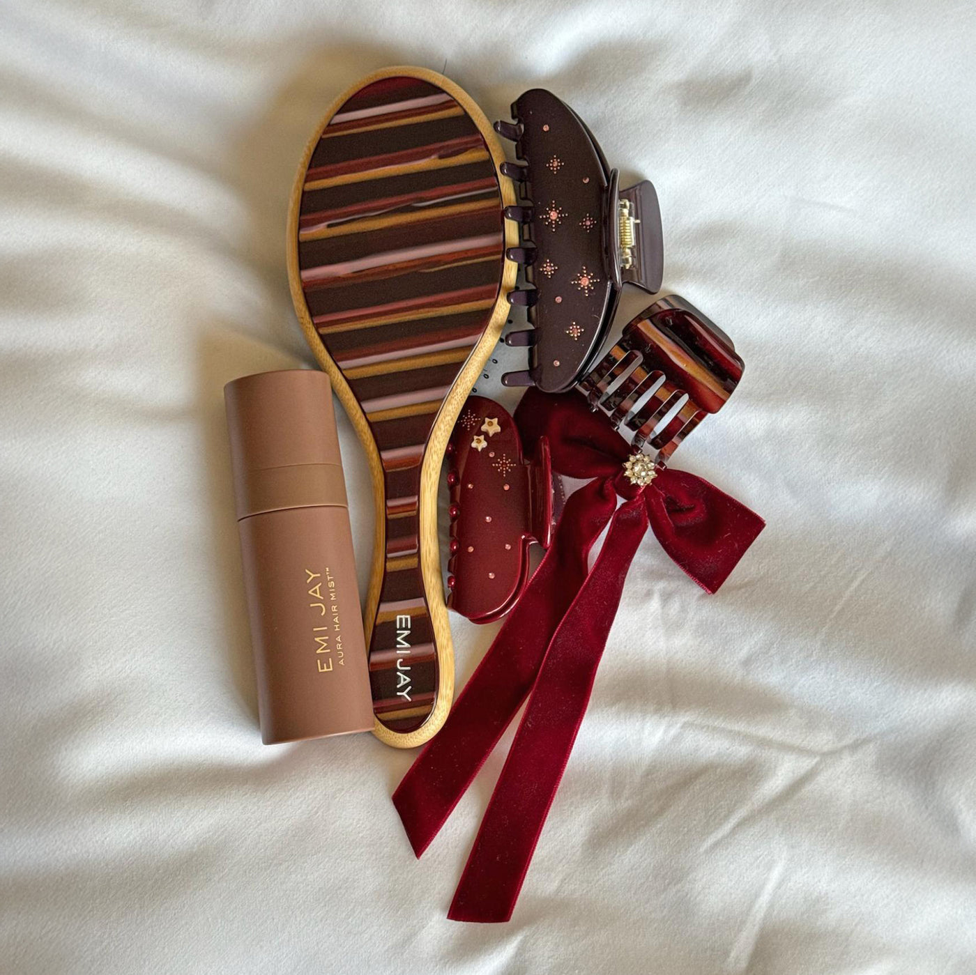 assorted nightcap hair accessories with aura hair + body mist