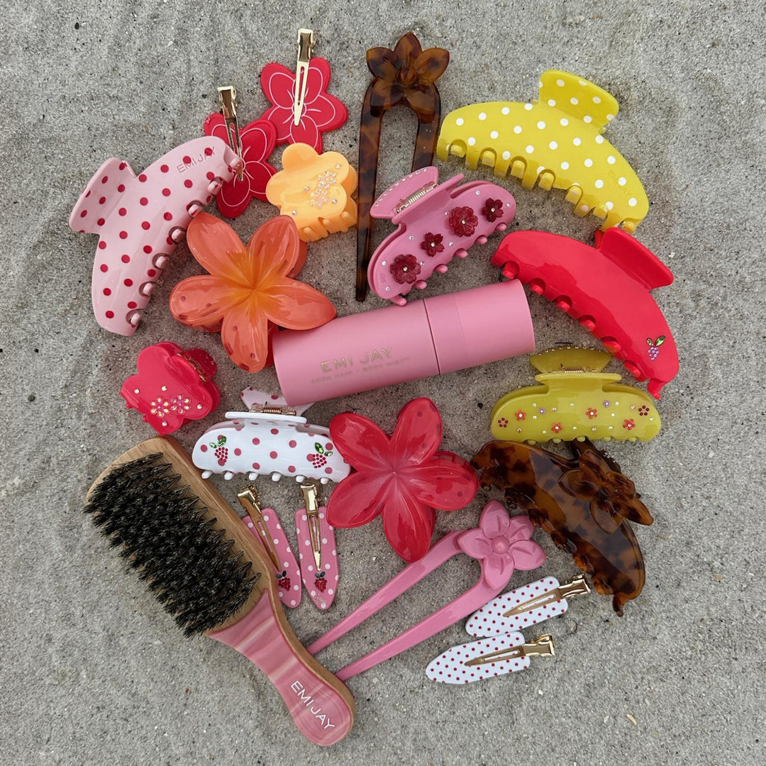 aura hair + body mist in lychee baby with assorted emi jay hair accessories, and brush