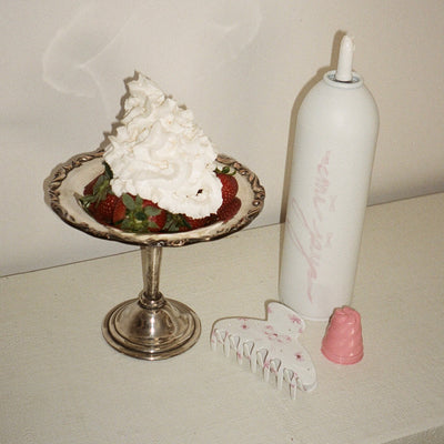 Big Effing Clip in Crème de la Crème next to strawberries and whipped cream