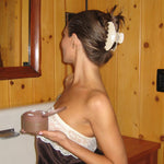 olivia jade holding Dream Crème™ in Toasted Sugar while wearing Big Effing Clip in Gingerbread Gingham in hair