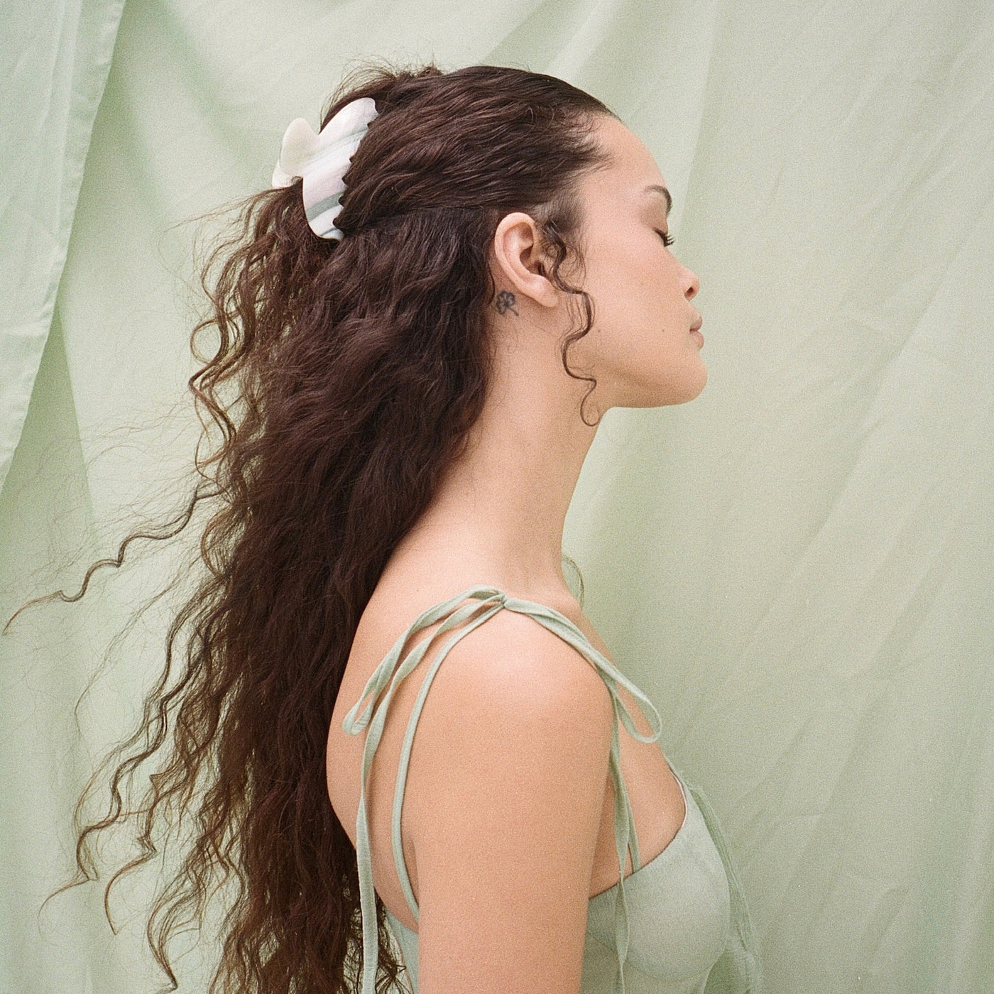 model wearing Big Effing Clip in Lilies of the Valley in hair