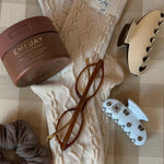 assorted emi jay hair clips with Dream Crème™ in Toasted Sugar, glasses, and socks