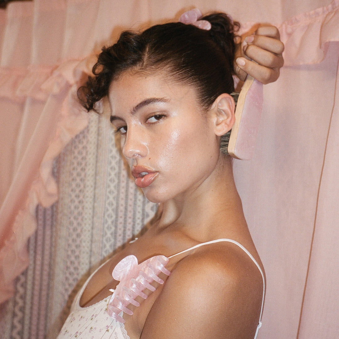 model with styling brush and 2 Big Effing Clips in Pink Sugar