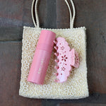 aura mist in lychee baby with Big Effing Clip in Rose Fleur Eyelet on bag
