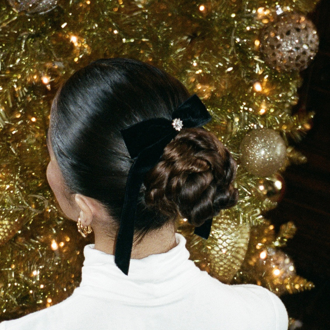 closeup of model wearing Bow Barrette in Iconic Velvet in hair