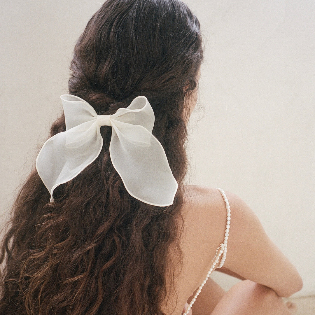 model wearing Bow Barrette in Oyster