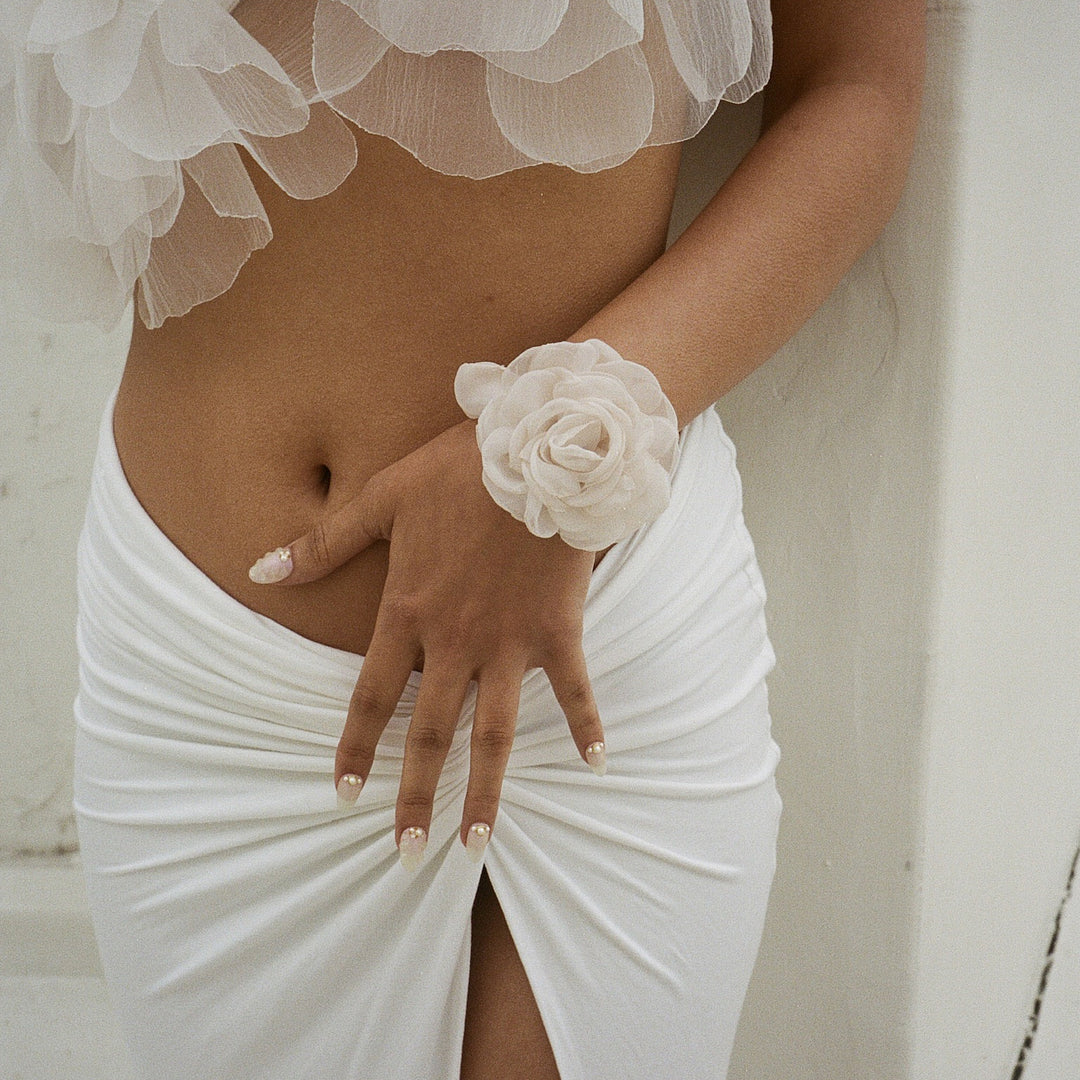 model wearing Camellia Scrunchie in Oyster on her wrist