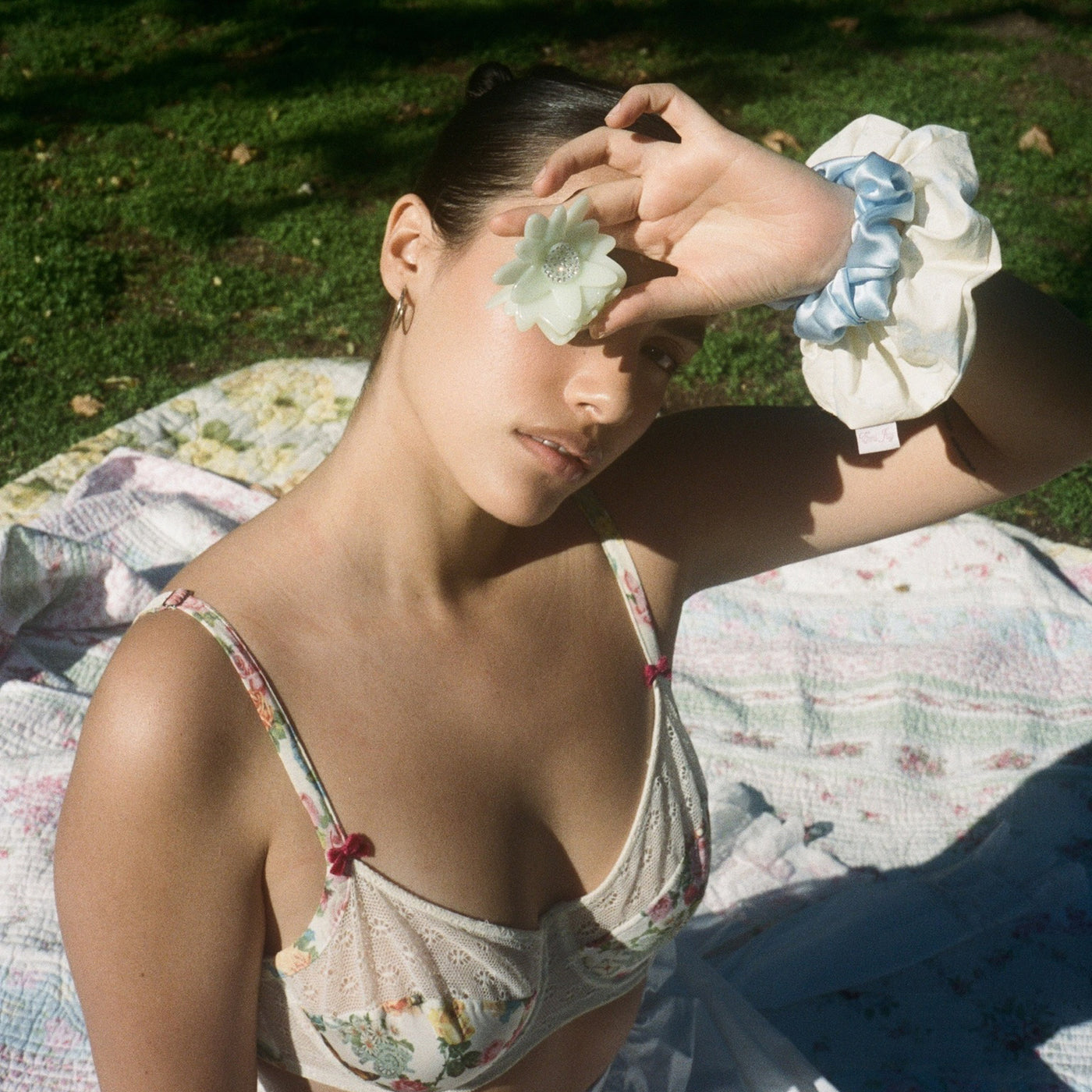 model holding clip with Linen Printed Scrunchie in Honey Butter on wrist